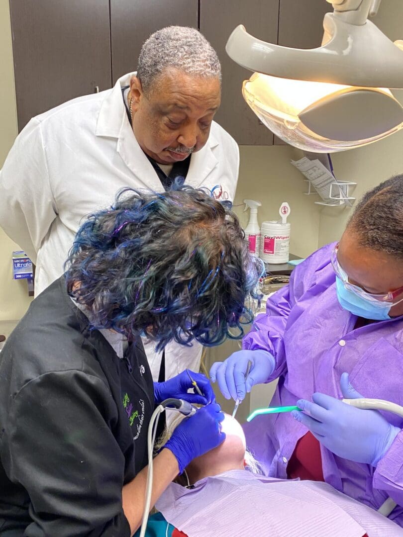 Dr. Andrew Kelly supervising live implant surgery