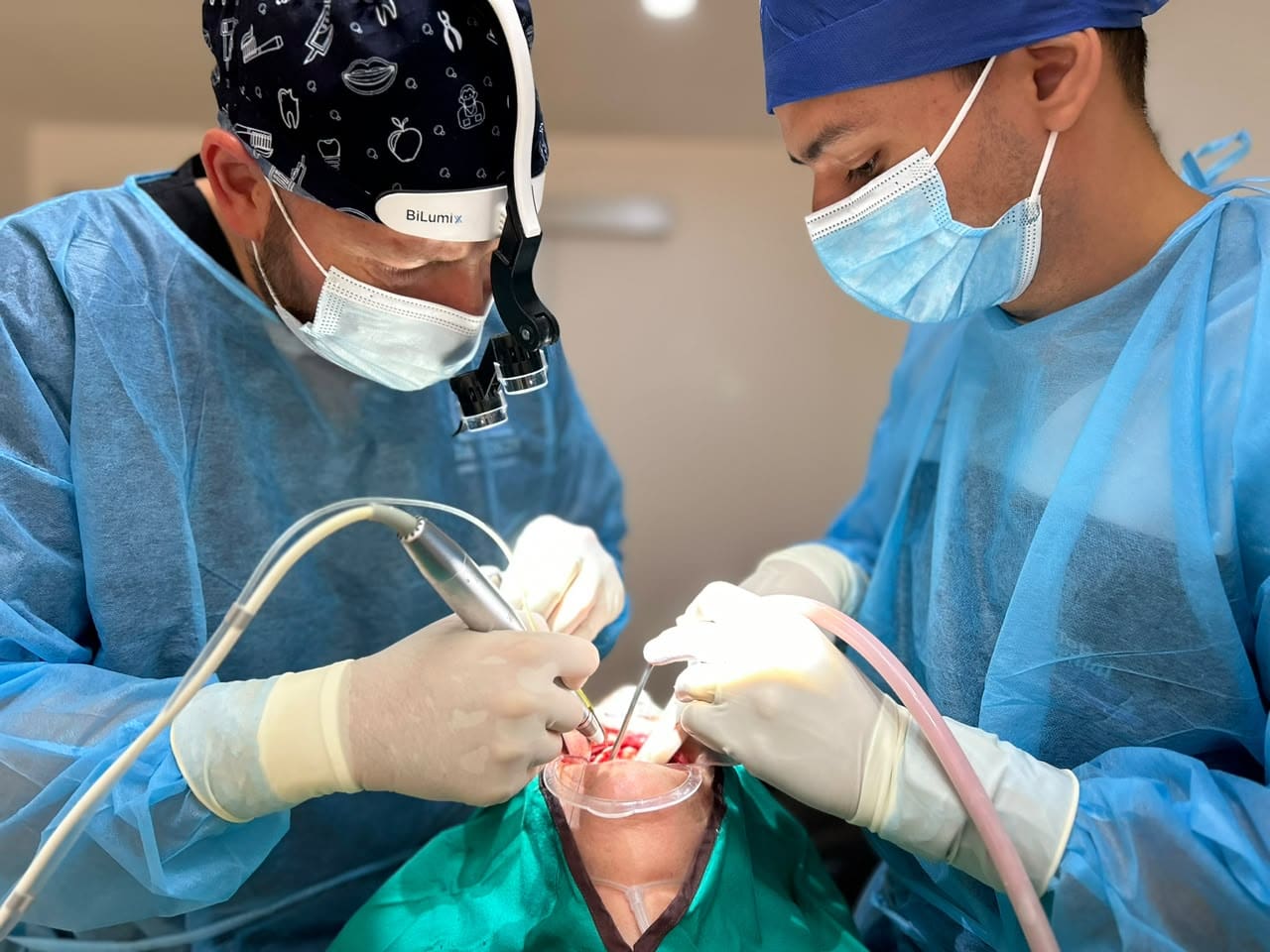 Live implant surgery under faculty supervision