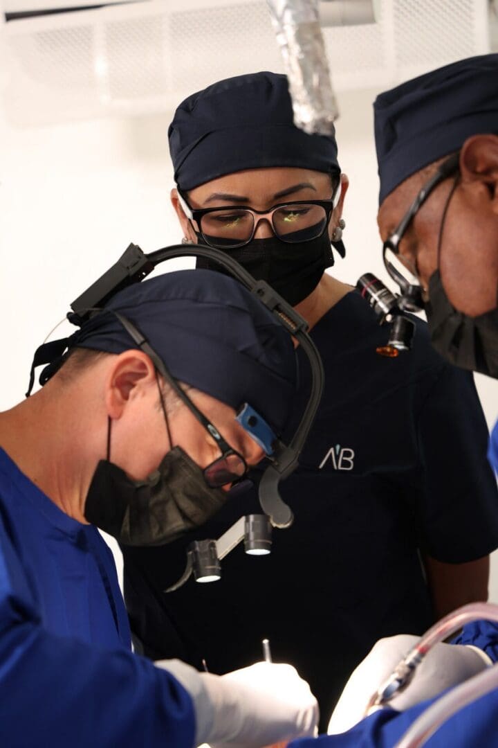 Faculty and participant during a live implant case